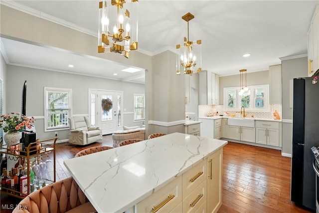 3270 S Canfield Niles Rd, Canfield, OH 44406 - kitchen with a chandelier, a sink, and plenty of natural light