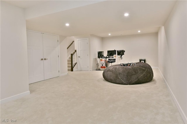 living area featuring stairs, baseboards, carpet floors, and recessed lighting