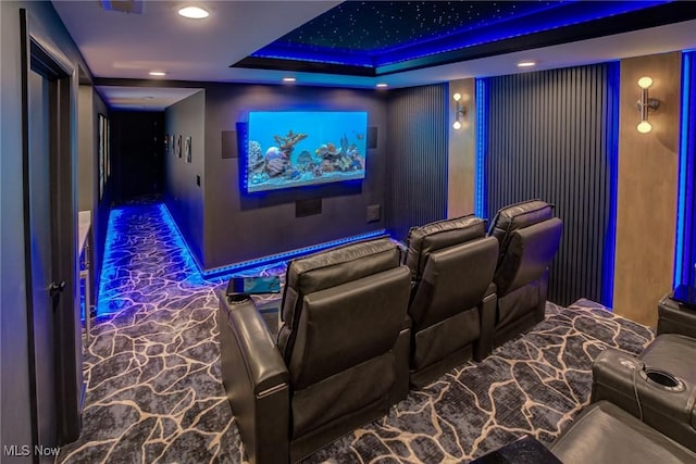 cinema room featuring baseboards, recessed lighting, and a raised ceiling