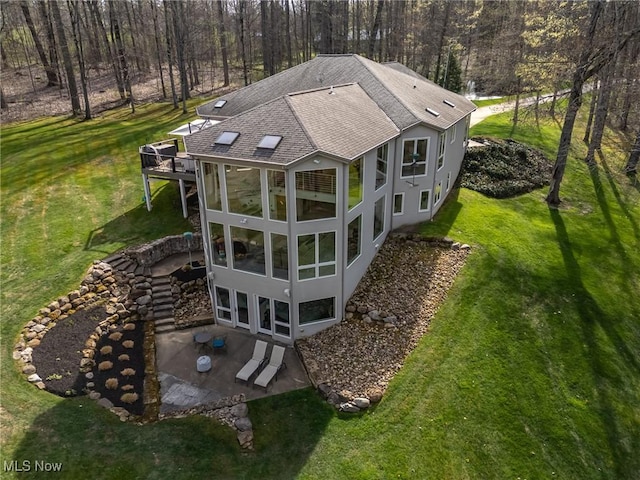 view of subject property featuring a forest