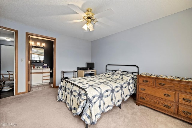 bedroom featuring ceiling fan, baseboards, and light carpet