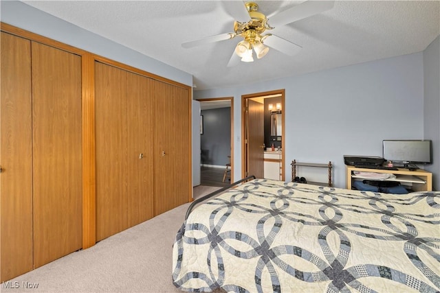 bedroom with a ceiling fan and carpet