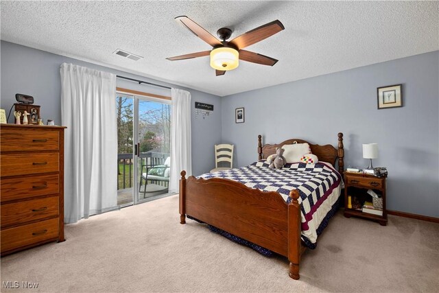bedroom with a textured ceiling, access to exterior, visible vents, ceiling fan, and carpet floors