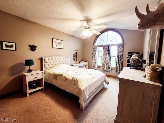 bedroom with baseboards, lofted ceiling, light colored carpet, and ceiling fan