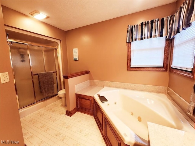 full bath with a shower stall, toilet, tile patterned floors, and a whirlpool tub