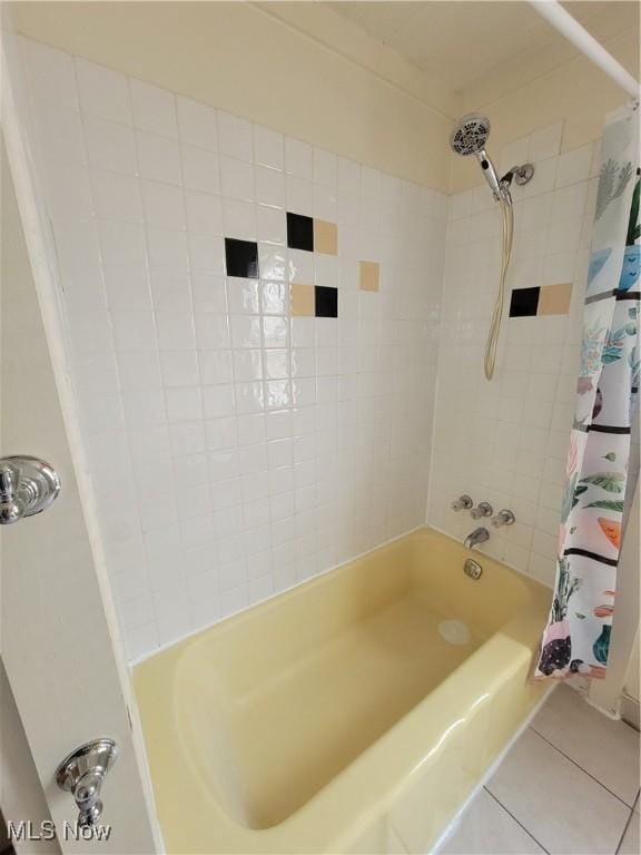full bathroom featuring shower / tub combo with curtain and tile patterned flooring
