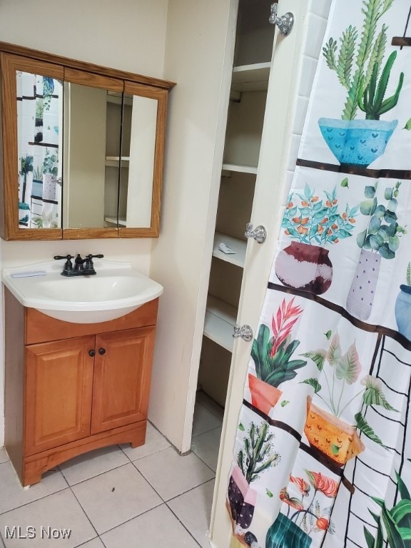 full bath featuring tile patterned floors and vanity