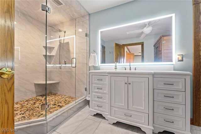 148 N Kimberly Ave N, Youngstown, OH 44515 - full bathroom featuring a shower stall, vanity, a ceiling fan, and marble look tile flooring