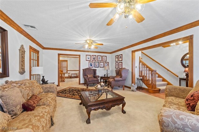 148 N Kimberly Ave N, Youngstown, OH 44515 - living area featuring a ceiling fan, stairs, carpet flooring, and crown molding