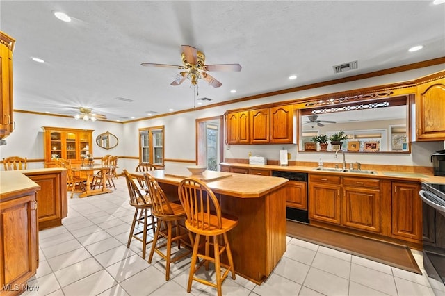 148 N Kimberly Ave N, Youngstown, OH 44515 - kitchen with dishwasher, ceiling fan, light countertops, crown molding, and range with electric stovetop