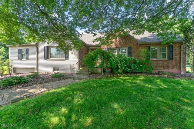 148 N Kimberly Ave N, Youngstown, OH 44515 - view of front of property featuring a front lawn and brick siding