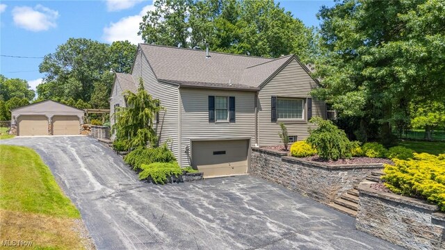148 N Kimberly Ave N, Youngstown, OH 44515 - view of front of home with a shingled roof and an outbuilding