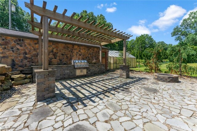 148 N Kimberly Ave N, Youngstown, OH 44515 - view of patio featuring a fire pit, an outdoor kitchen, and a pergola