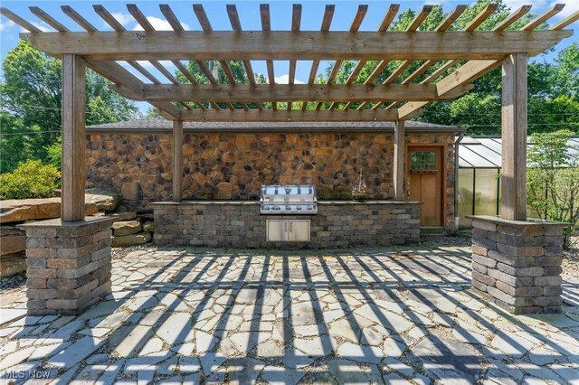 148 N Kimberly Ave N, Youngstown, OH 44515 - view of patio with area for grilling and a pergola