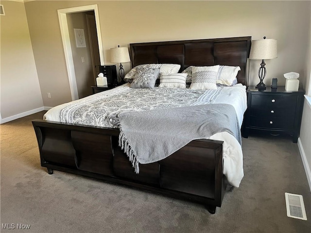 bedroom featuring baseboards, visible vents, and carpet floors