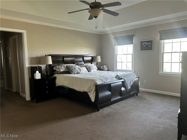 carpeted bedroom featuring baseboards, ceiling fan, and crown molding