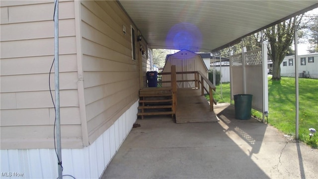 46 Navajo, Creston, OH 44217 - view of patio featuring a storage unit and an outbuilding