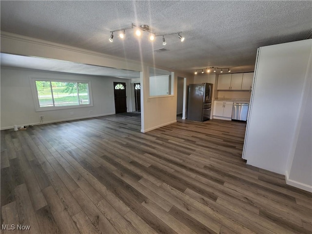 1490 Evergreen Dr, Streetsboro, OH 44241 - unfurnished living room featuring track lighting, dark wood finished floors, and a textured ceiling