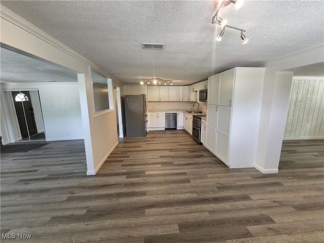 1490 Evergreen Dr, Streetsboro, OH 44241 - kitchen featuring a textured ceiling, rail lighting, stainless steel appliances, and a sink