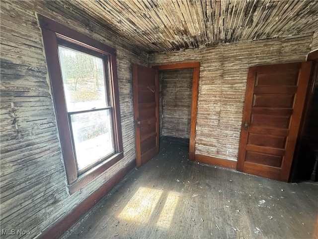 unfurnished room with wood-type flooring