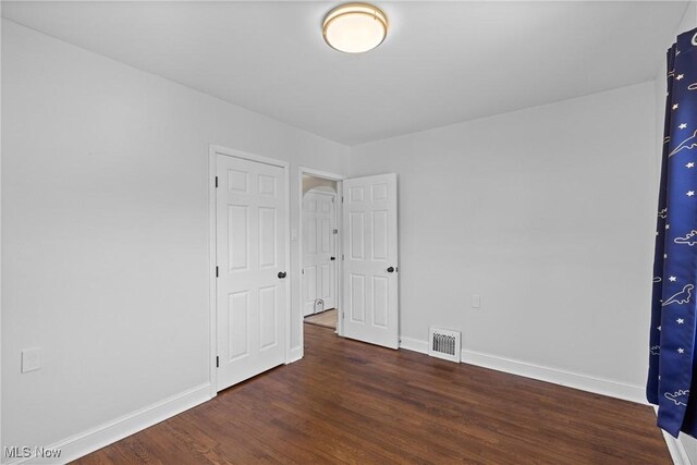 120 Hillcrest Dr, Wellsburg, WV 26070 - unfurnished bedroom featuring visible vents, baseboards, and wood finished floors