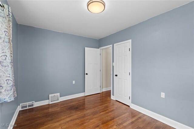 120 Hillcrest Dr, Wellsburg, WV 26070 - unfurnished bedroom featuring wood finished floors, visible vents, and baseboards
