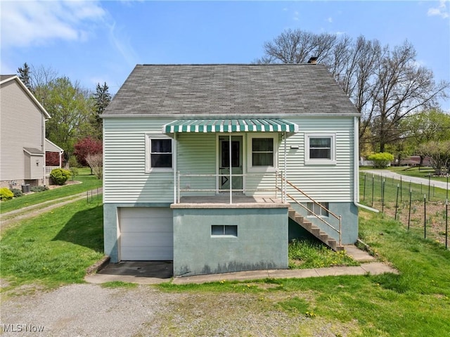 120 Hillcrest Dr, Wellsburg, WV 26070 - back of property with roof with shingles, driveway, an attached garage, stairs, and a yard