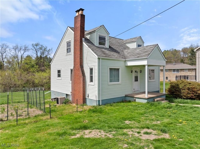 120 Hillcrest Dr, Wellsburg, WV 26070 - rear view of property with a chimney, roof with shingles, a yard, and central AC