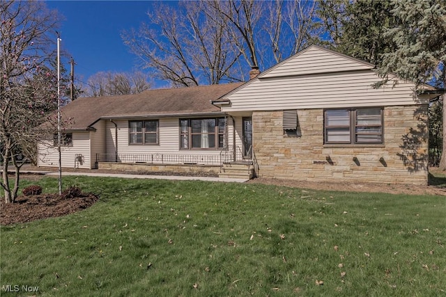 ranch-style home featuring stone siding, a front lawn, and a shingled roof
