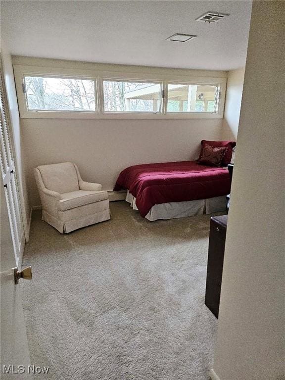 bedroom featuring visible vents and carpet floors