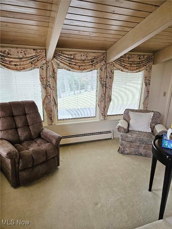 living area featuring wood ceiling, baseboard heating, carpet flooring, and beamed ceiling
