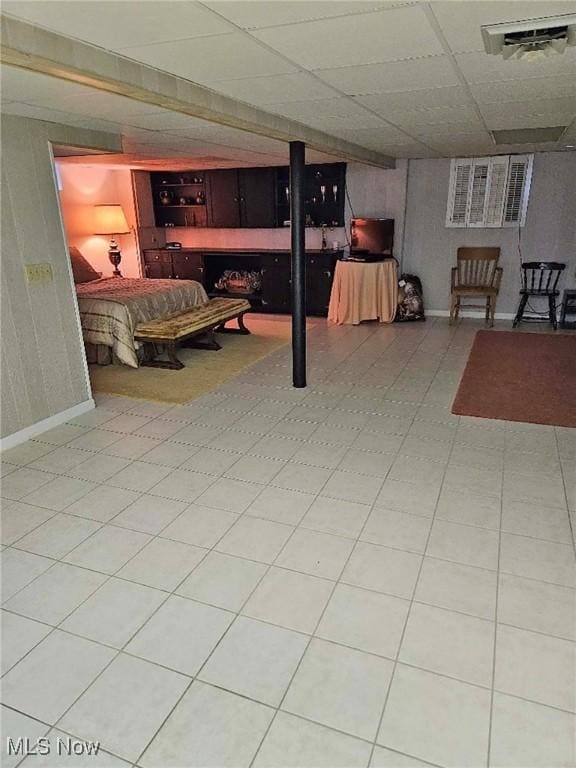 805 Lynnwood Dr, Minerva, OH 44657 - bedroom featuring baseboards, a drop ceiling, and tile patterned floors