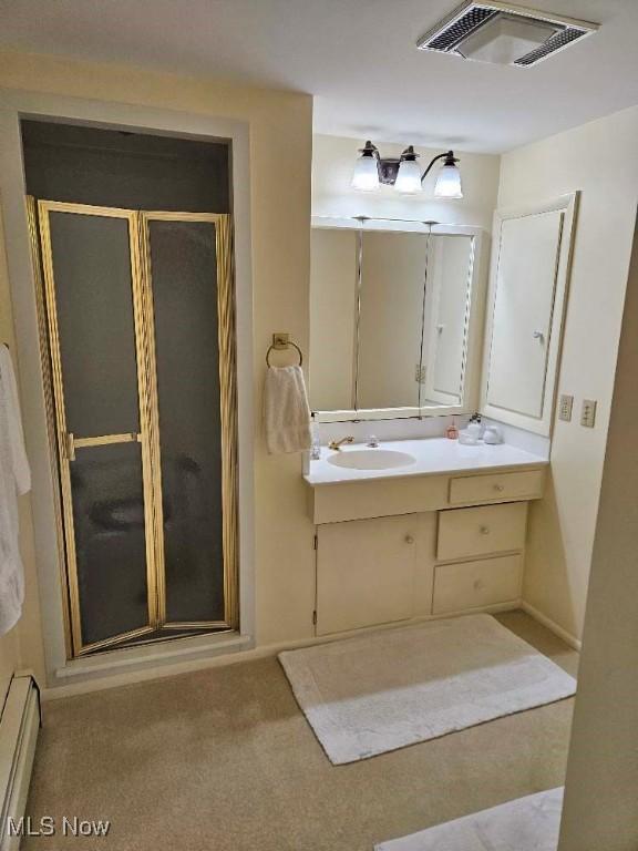 805 Lynnwood Dr, Minerva, OH 44657 - full bath featuring a baseboard heating unit, a shower stall, and vanity