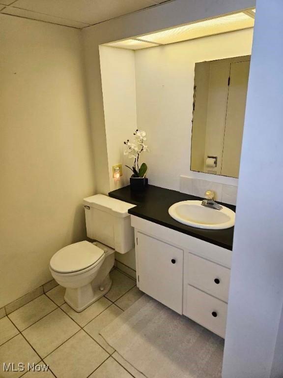 805 Lynnwood Dr, Minerva, OH 44657 - half bathroom featuring tile patterned floors, vanity, and toilet