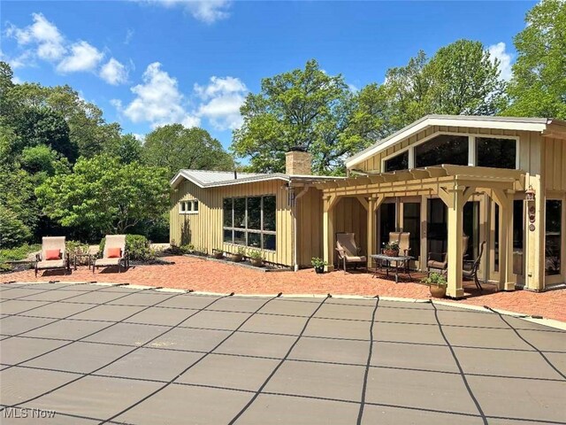 805 Lynnwood Dr, Minerva, OH 44657 - back of property with a patio area and a chimney