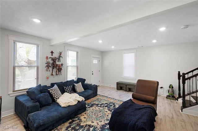 3407 Erin Ave, Cleveland, OH 44113 - living area featuring light wood-style floors, a wealth of natural light, and baseboards