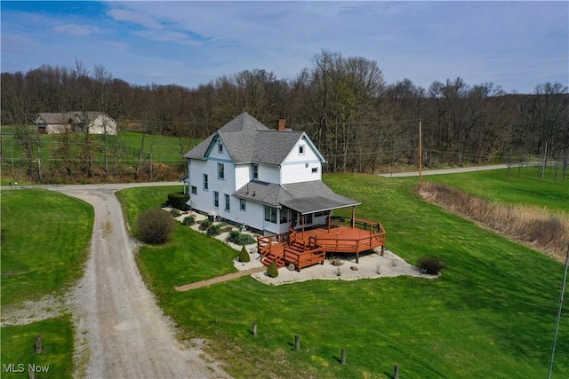 birds eye view of property with a wooded view