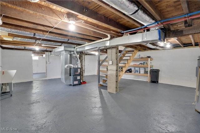 below grade area with stairway and heating unit