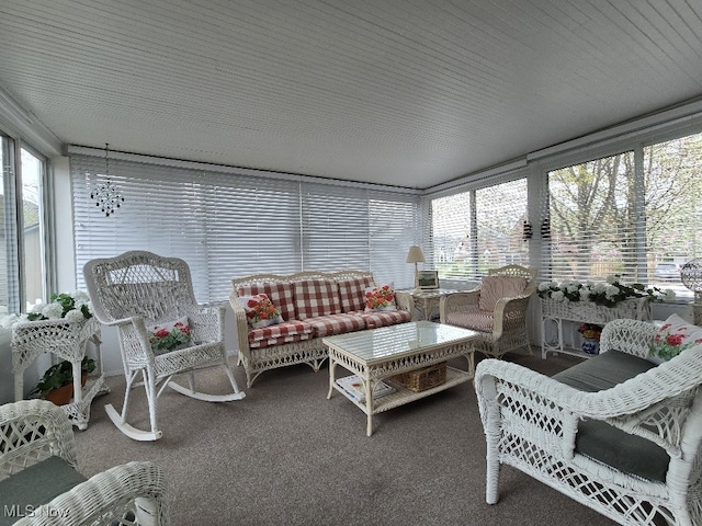 sunroom / solarium featuring carpet floors