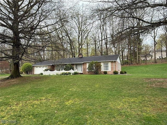 2476 Willow Brook Dr NW, Dover, OH 44622 - single story home featuring a chimney, brick siding, a front yard, and a garage