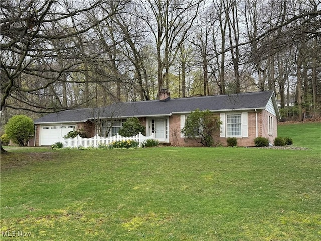 2476 Willow Brook Dr NW, Dover, OH 44622 - ranch-style home featuring a chimney, a front lawn, an attached garage, fence, and brick siding