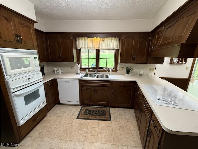 2476 Willow Brook Dr NW, Dover, OH 44622 - kitchen with light countertops, white appliances, a sink, and a textured ceiling