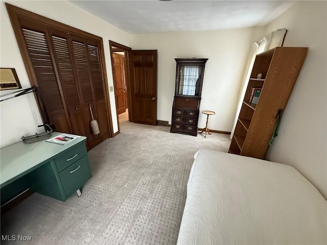 2476 Willow Brook Dr NW, Dover, OH 44622 - bedroom featuring light carpet, baseboards, and a closet