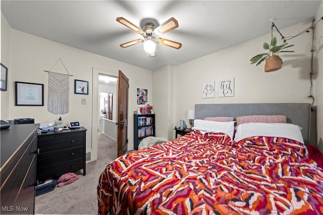 carpeted bedroom featuring ceiling fan
