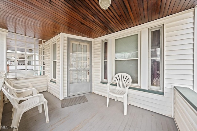 doorway to property with a porch