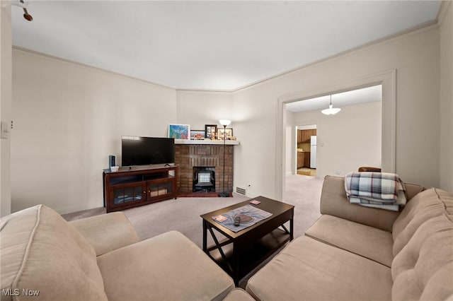 carpeted living room with ornamental molding
