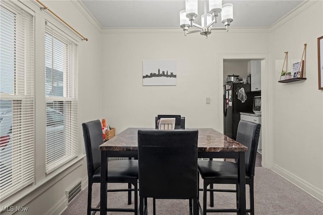 dining space featuring carpet flooring, a notable chandelier, and ornamental molding