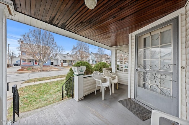 view of patio featuring a residential view and covered porch