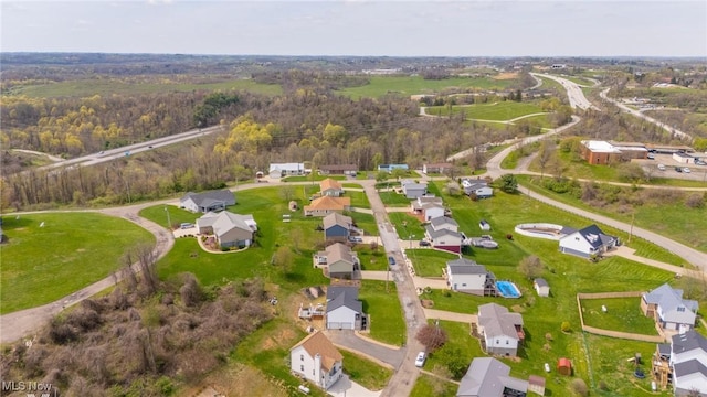 53206 Poplar Dr, Bridgeport, OH 43912 - aerial view of property's location with nearby suburban area and a forest
