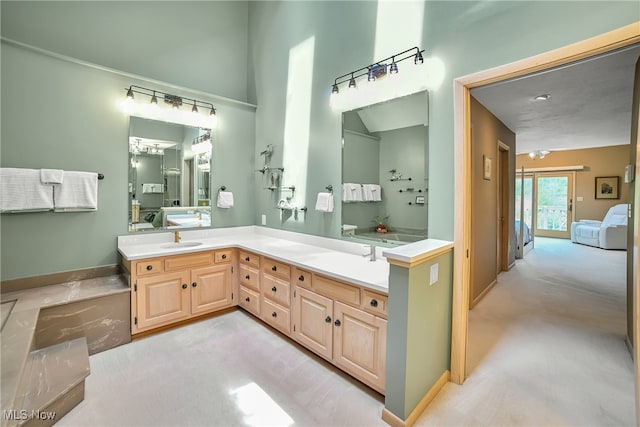 bathroom featuring a sink, double vanity, and connected bathroom